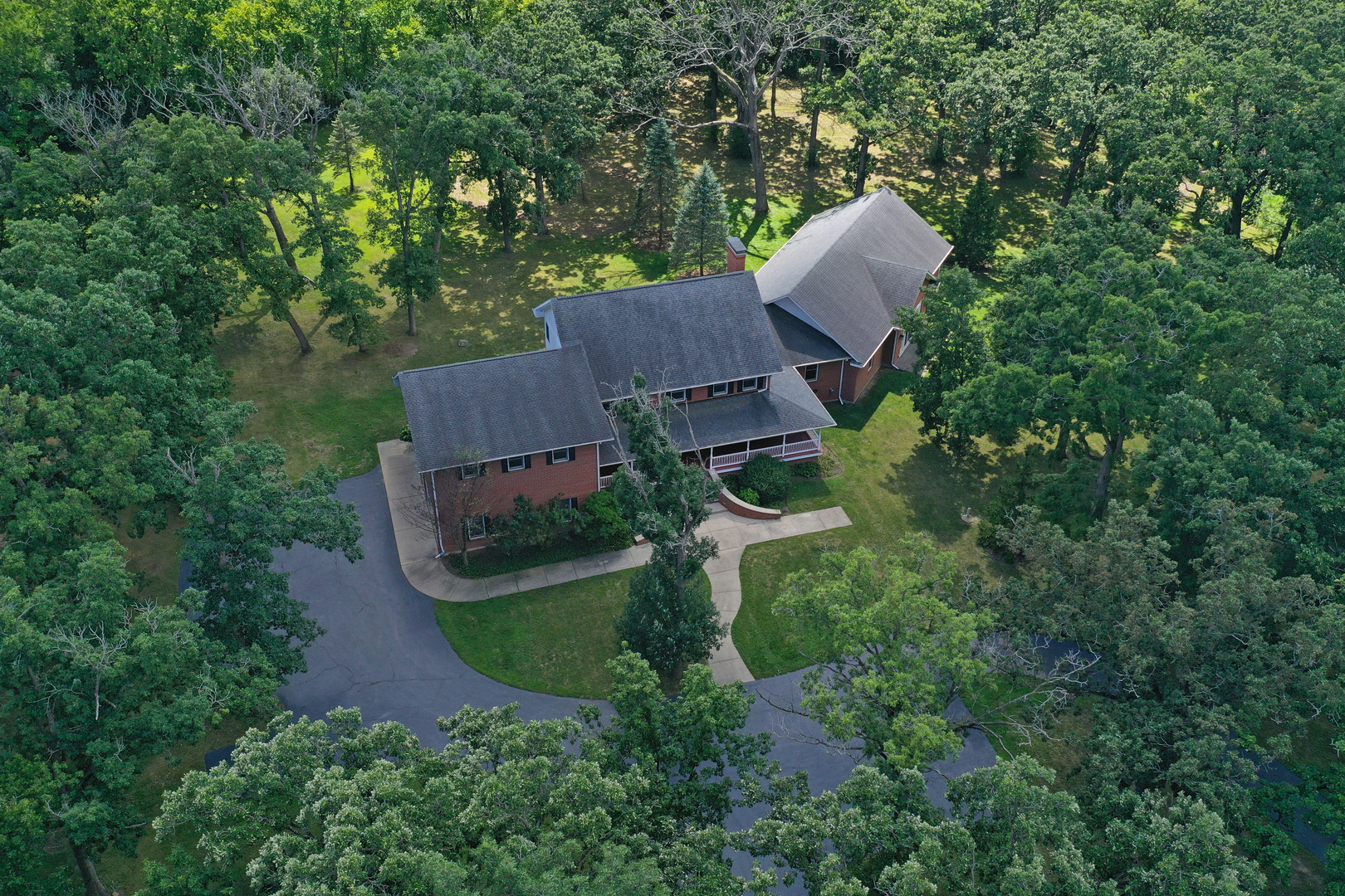 28232 North Gilmer Road Grayslake, IL 60030 - Photo 4 of 74 an aerial view of a house with yard and outdoor seating