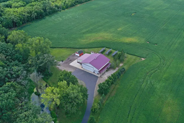 a aerial view of a house with a yard