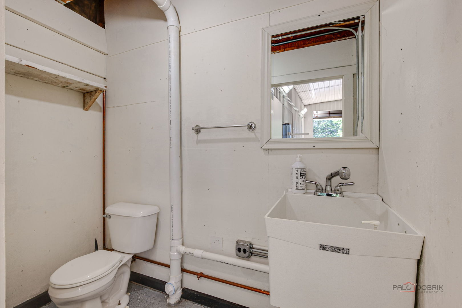 28232 North Gilmer Road Grayslake, IL 60030 - Photo 61 of 74 a bathroom with a toilet sink vanity and mirror
