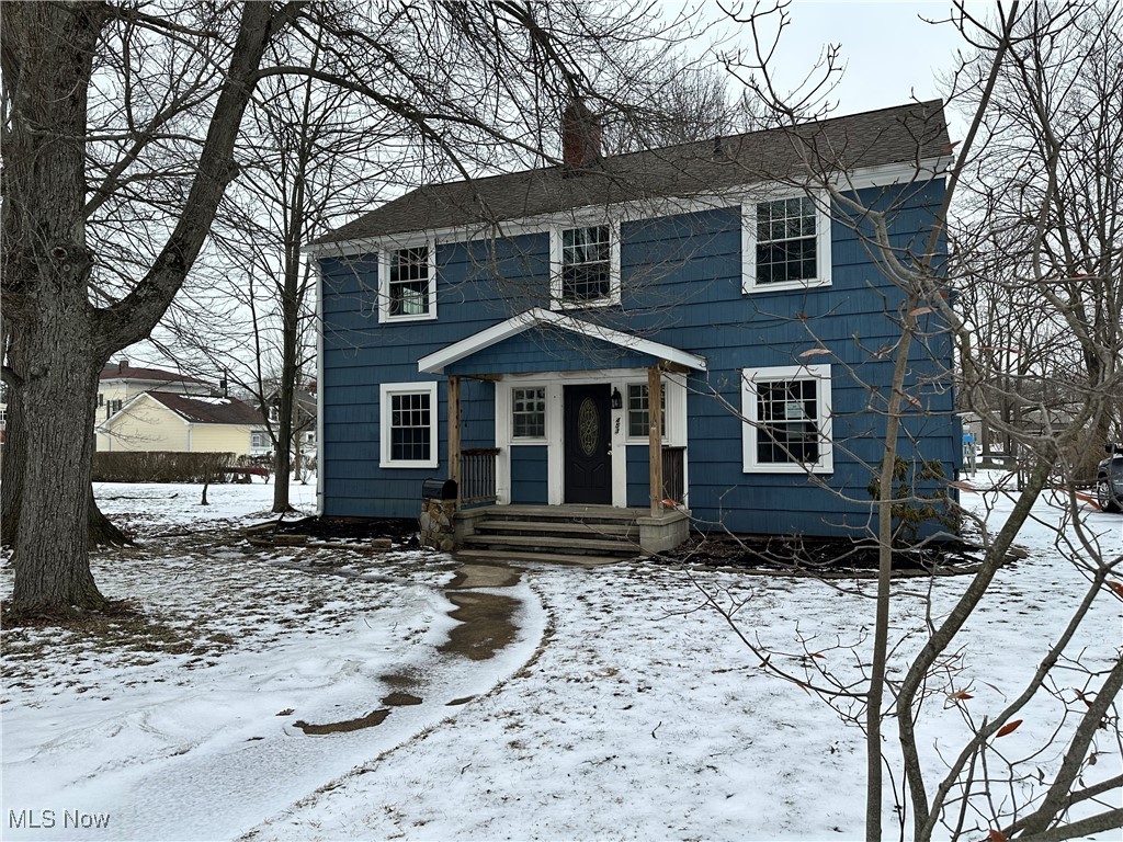Colonial inspired home with a chimney