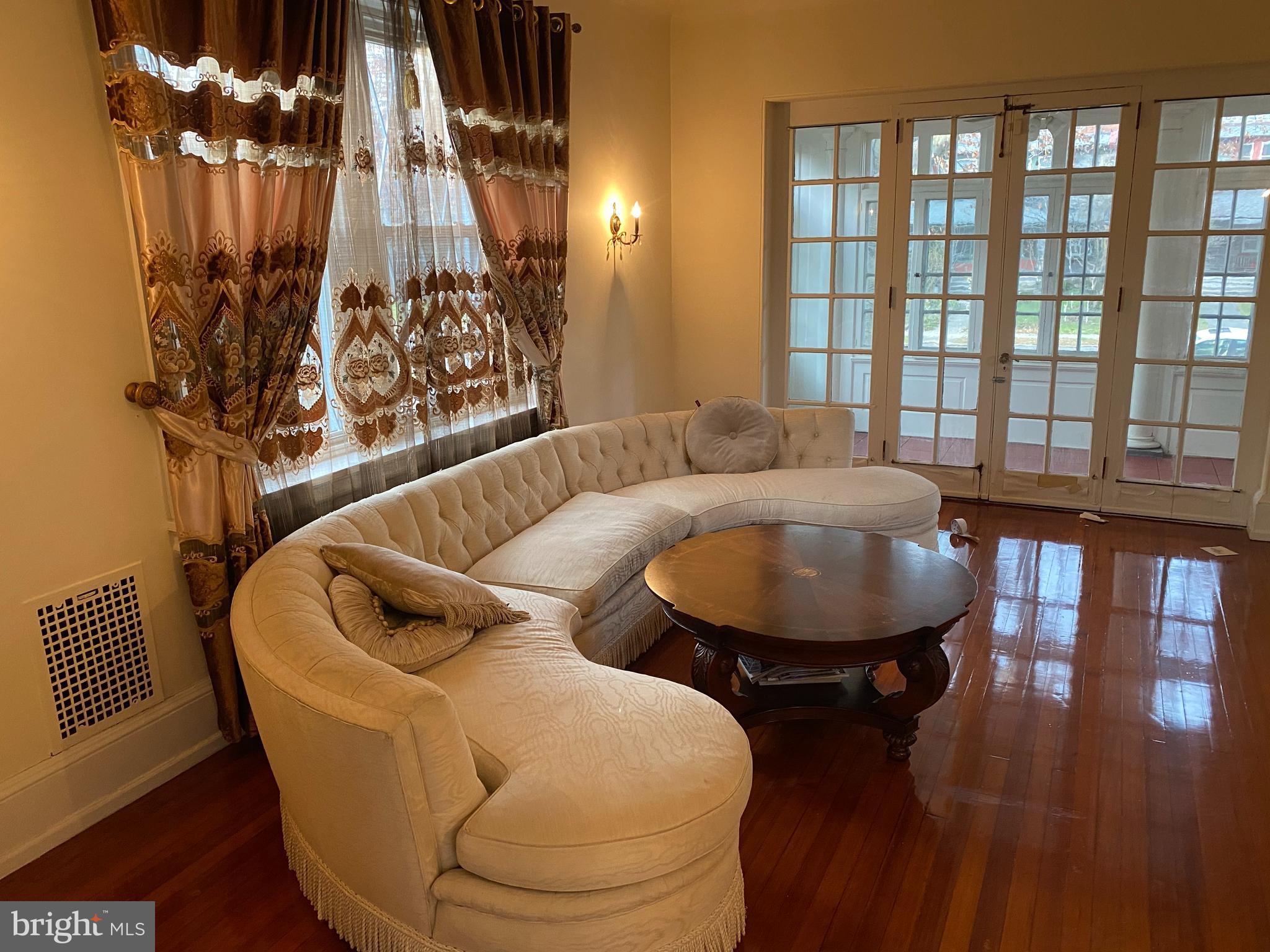 6358 Sherwood Road Philadelphia, PA 19151 - Photo 10 of 30 Living Room - entrance to enclosed porch