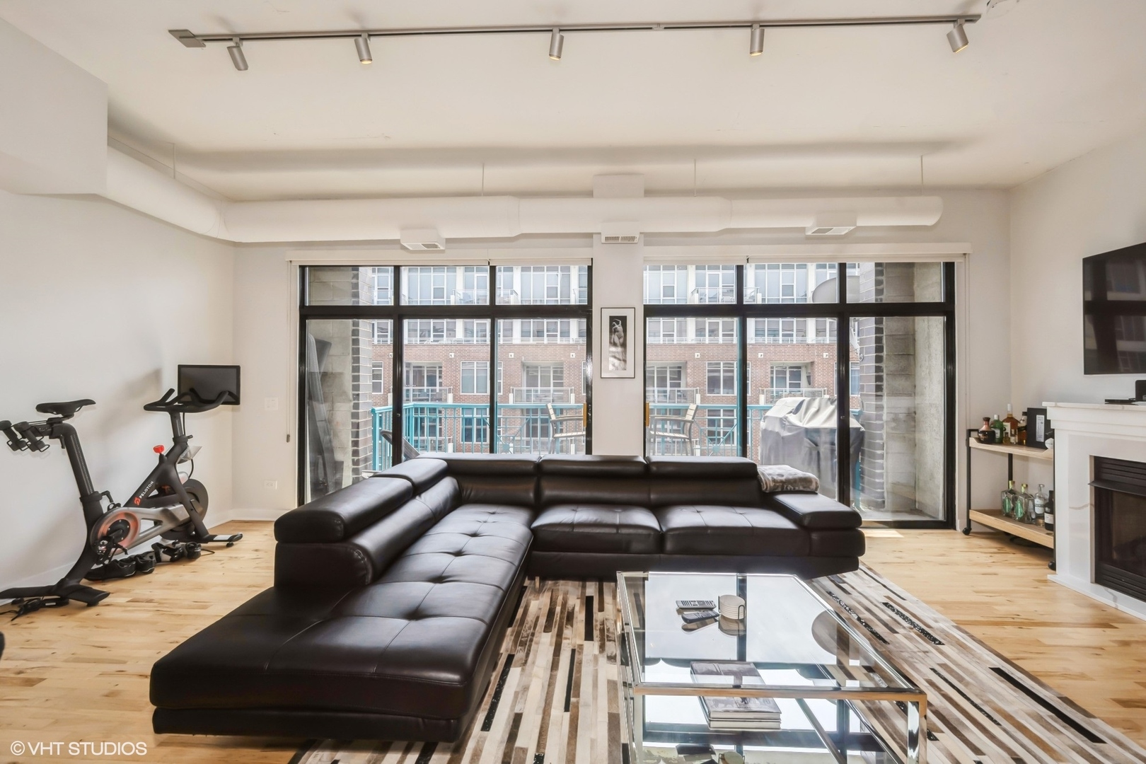 910 West Madison Street, Unit 802 Chicago, IL 60607 - Photo 2 of 13 a living room with furniture and a floor to ceiling window