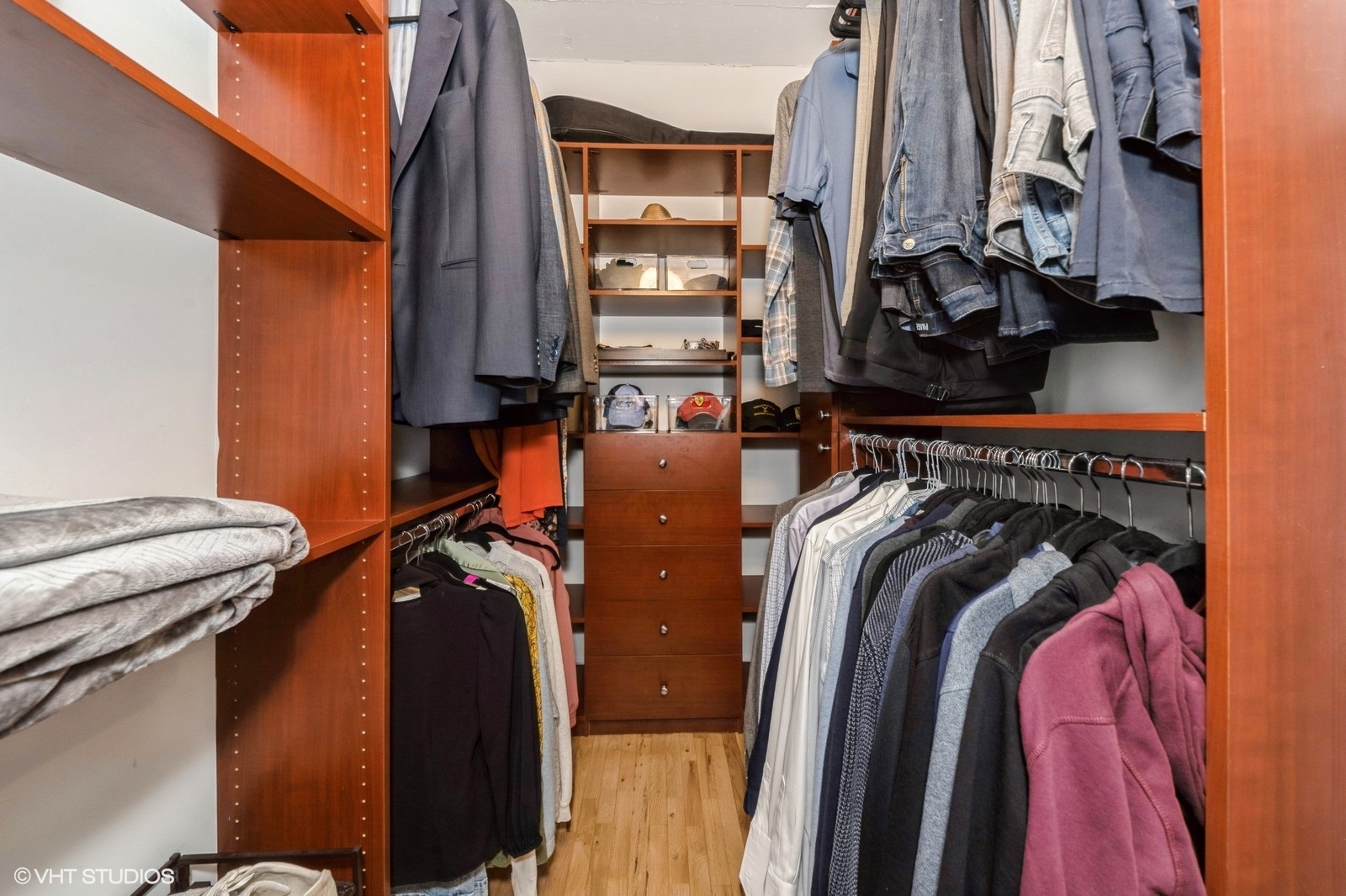 910 West Madison Street, Unit 802 Chicago, IL 60607 - Photo 8 of 13 a view of walk in closet with clothes and shoes