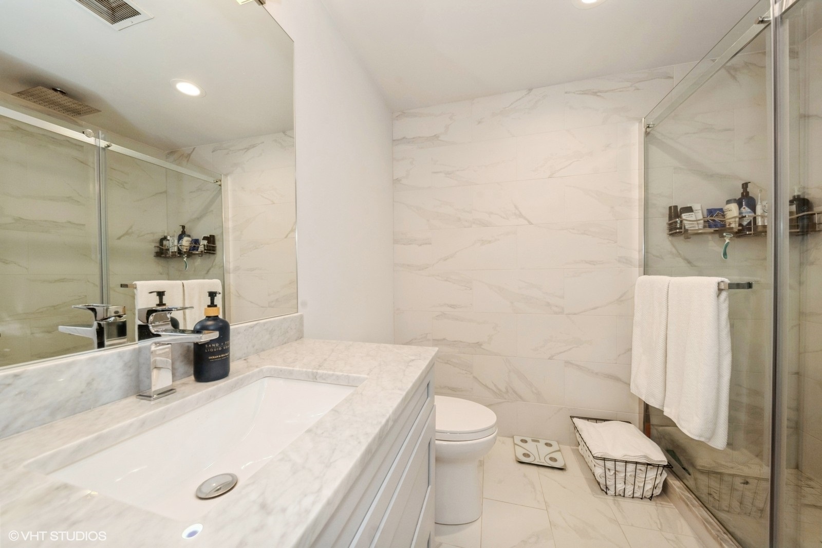 910 West Madison Street, Unit 802 Chicago, IL 60607 - Photo 9 of 13 a bathroom with a sink a toilet and shower