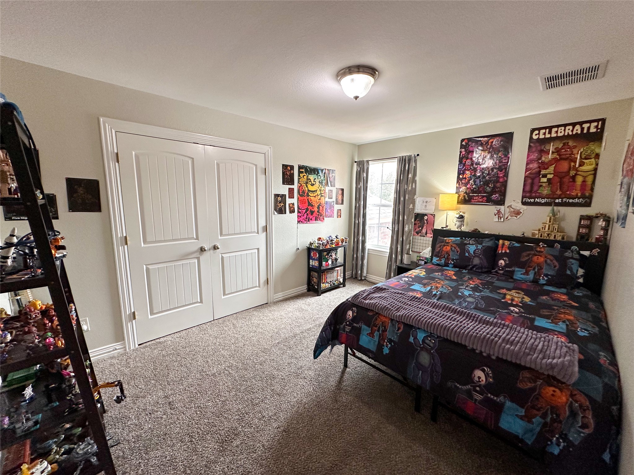 237 Cardinal Drive Paige, TX 78659 - Photo 26 of 37 Bedroom featuring carpet and a closet