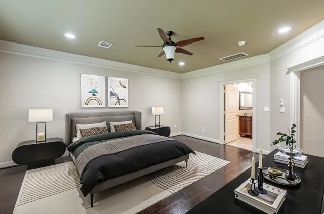 a bedroom with a bed window and a table