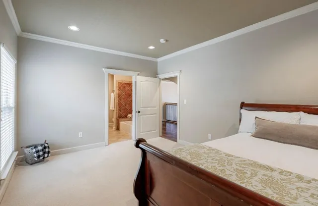 a bedroom with a bed and a couch