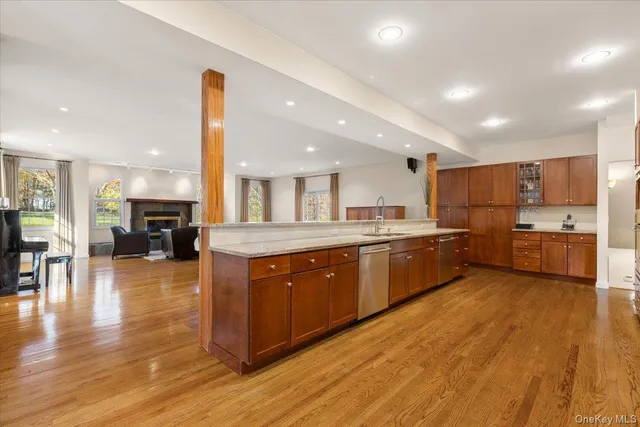 a large kitchen with stainless steel appliances lots of counter space and a sink