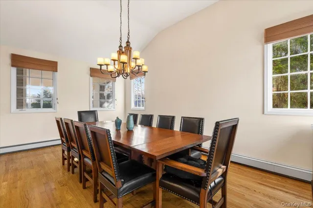 a dining room with furniture and window