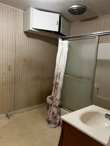 a bathroom with a sink and a shower