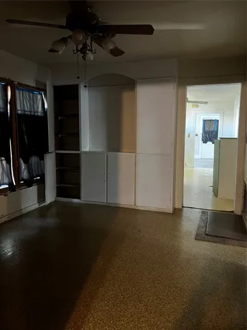 a view of empty room with windows