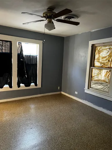 a view of an empty room with glass door