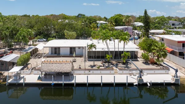 a view of house with outdoor space and lake view