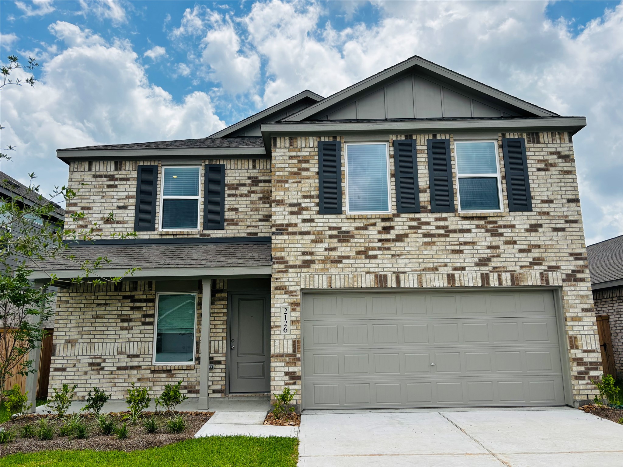2126 Mosaic Vly Court Angleton, TX 77515 - Photo 1 of 40 a front view of a house with garden