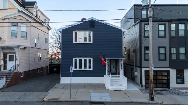 a view of a house with a street
