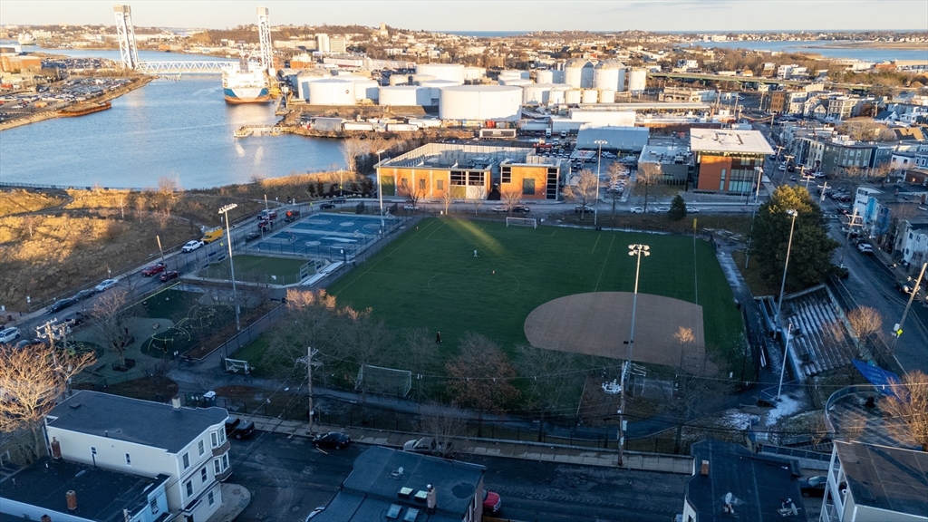 262 East Eagle Street, Unit 2 Boston, MA 02128 - Photo 23 of 24 an aerial view of a house with a yard and lake view
