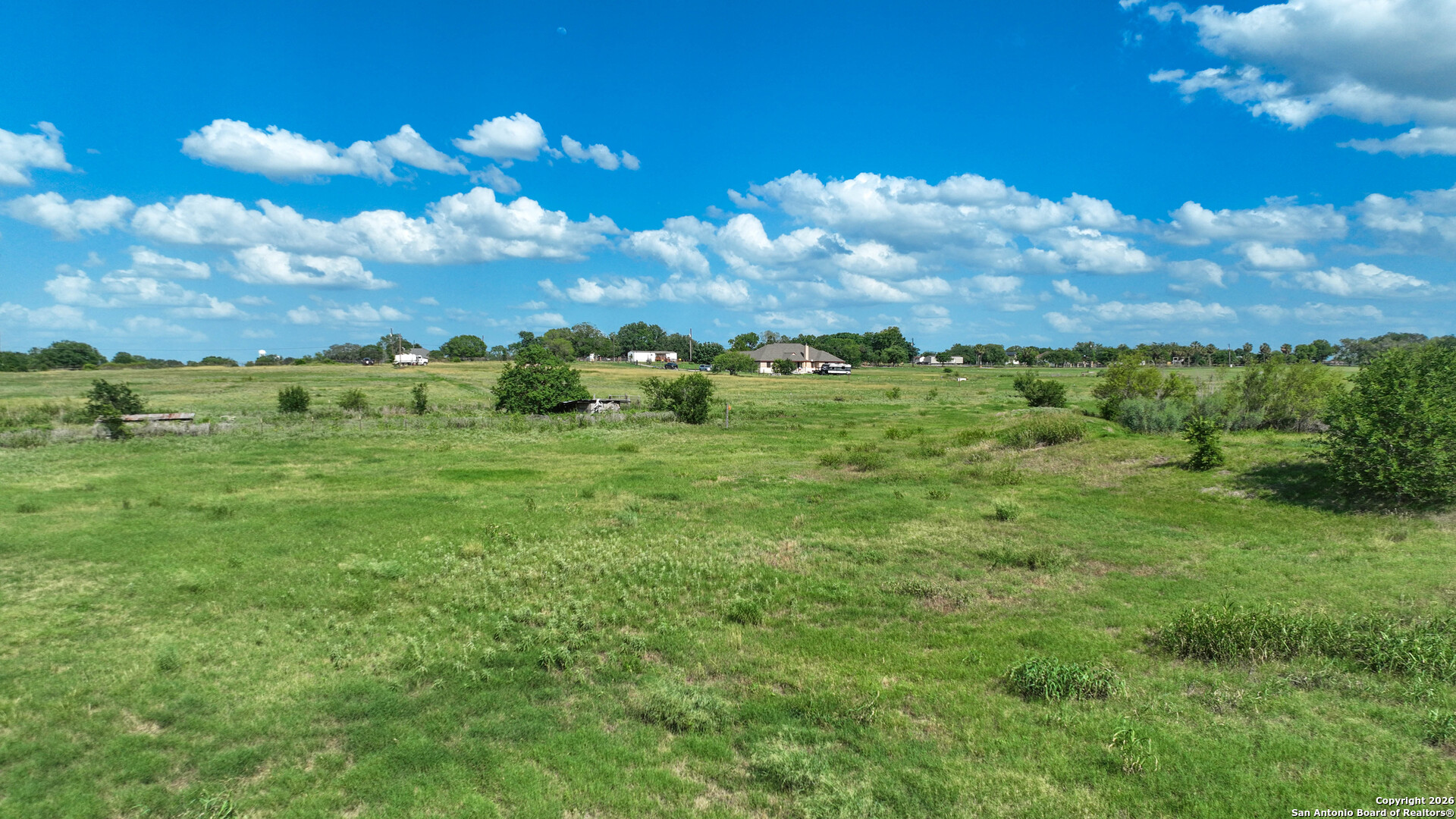 12725 Wisdom Road Atascosa, TX 78002 - Photo 11 of 18 a view of a big yard with lots of green space
