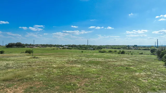 a view of a lake with houses in the back