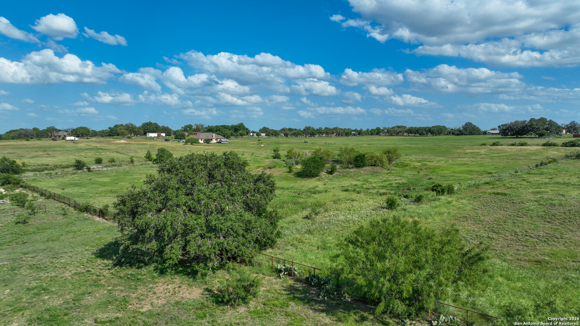 12725 Wisdom Road Atascosa, TX 78002 - Photo 2 of 18 a view of a city with lush green forest