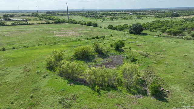 a view of a field with an ocean view