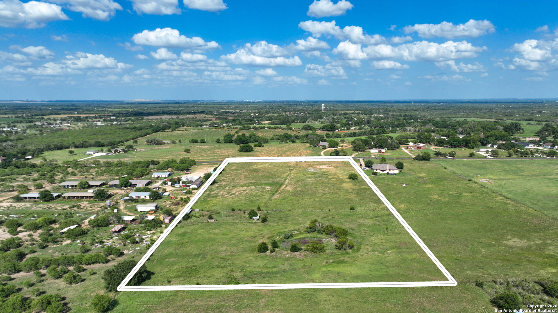 12725 Wisdom Road Atascosa, TX 78002 - Photo 6 of 18 a view of a back yard of the house