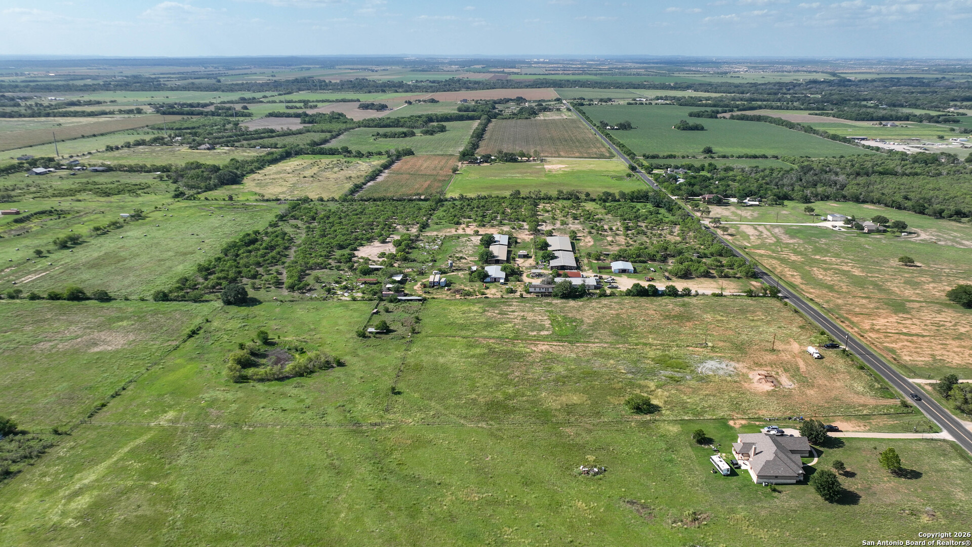12725 Wisdom Road Atascosa, TX 78002 - Photo 7 of 18 a view of a lake with a yard