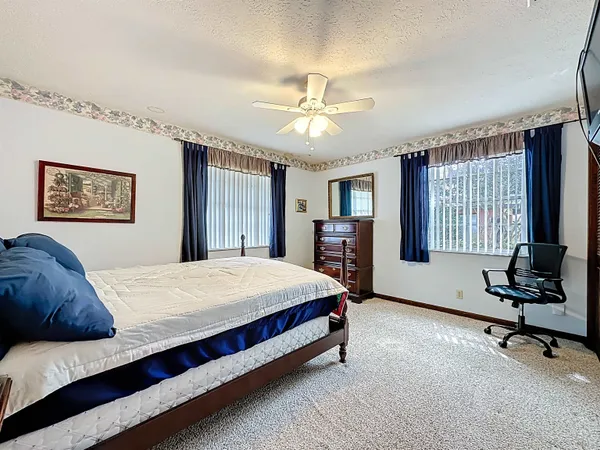 a bedroom with furniture and window