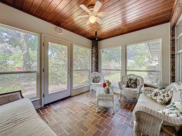 a view of a field with trees