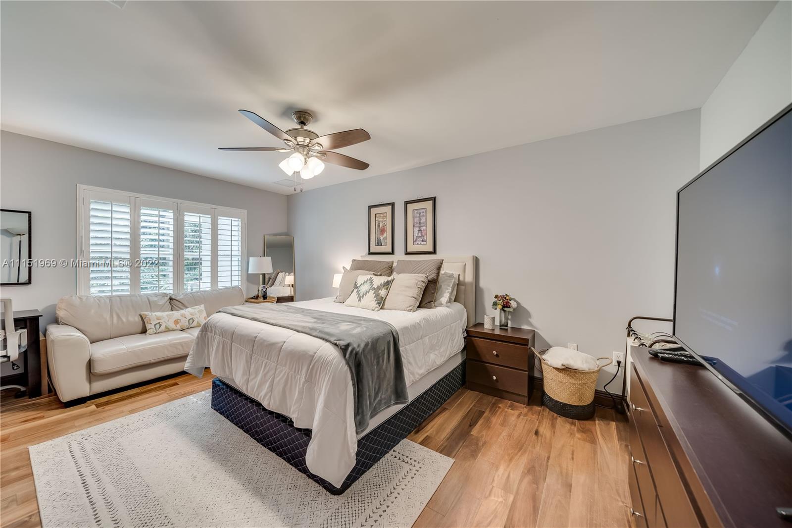 5001 Southwest 196th Lane Southwest Ranches, FL 33332 - Photo 29 of 72 a spacious bedroom with a bed and a couch