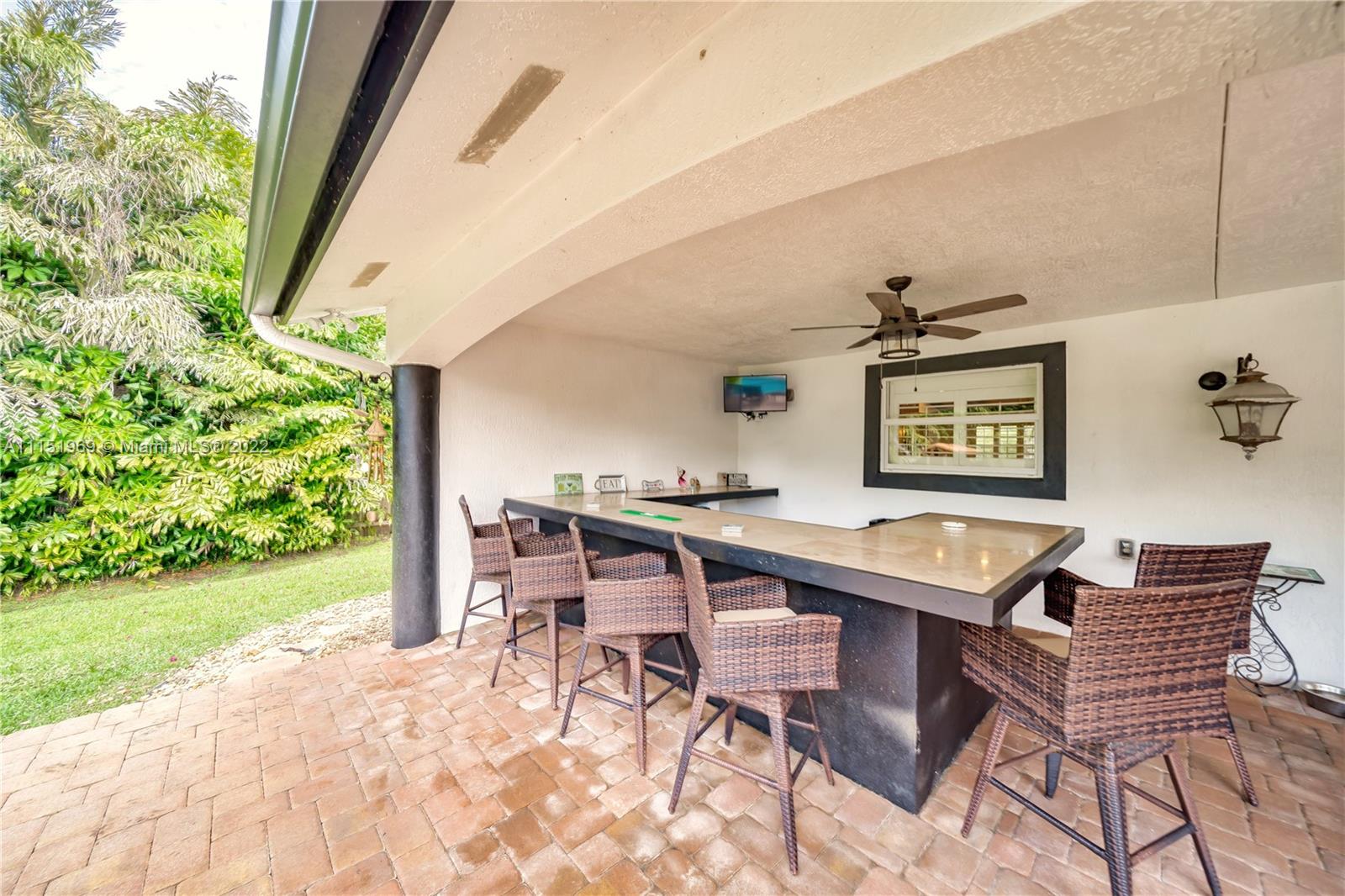 5001 Southwest 196th Lane Southwest Ranches, FL 33332 - Photo 56 of 72 a dining room with a wooden table and chairs