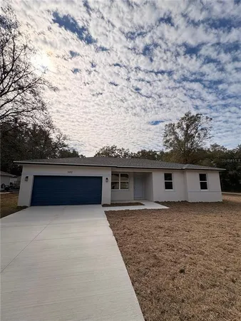 a house view with a backyard space