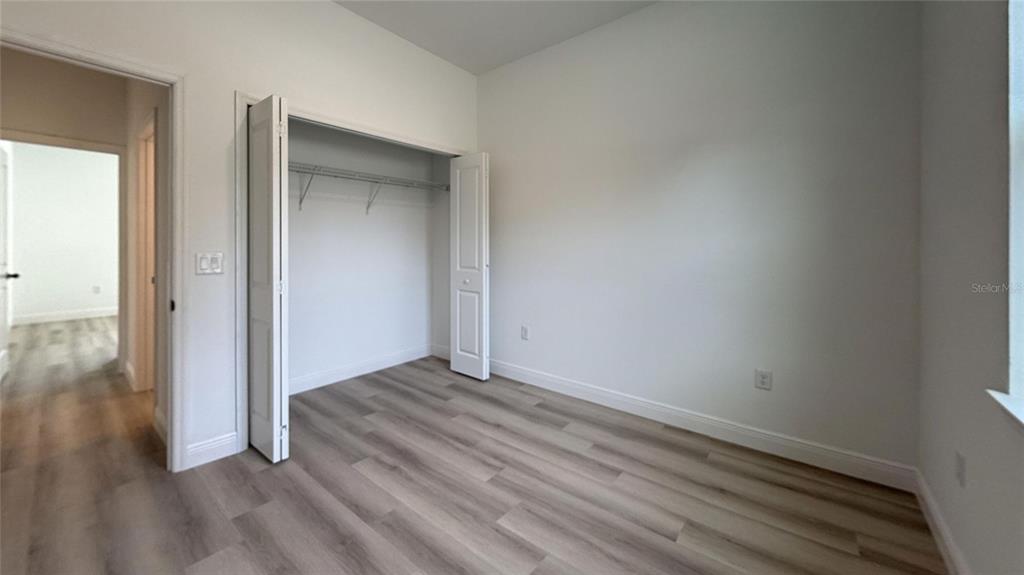 2018 West Magenta Drive Citrus Springs, FL 34434 - Photo 12 of 19 a view of an empty room with wooden floor