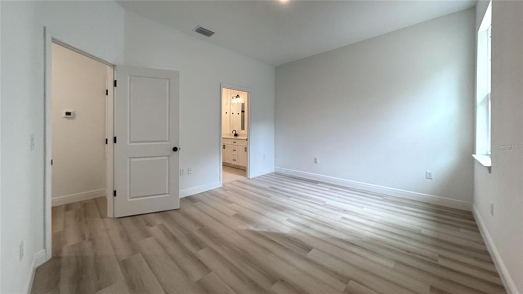 2018 West Magenta Drive Citrus Springs, FL 34434 - Photo 15 of 19 a view of empty room with wooden floor