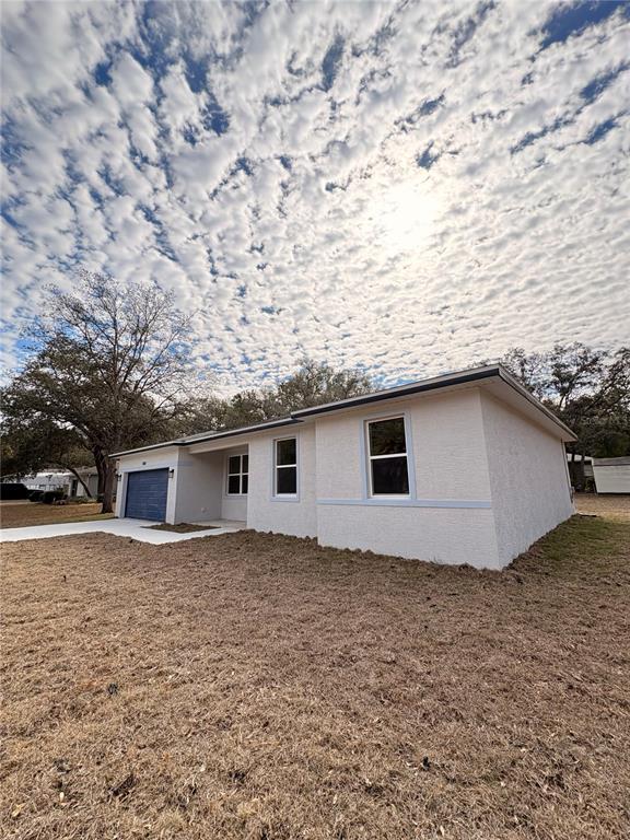 2018 West Magenta Drive Citrus Springs, FL 34434 - Photo 2 of 19 a house with a outdoor space