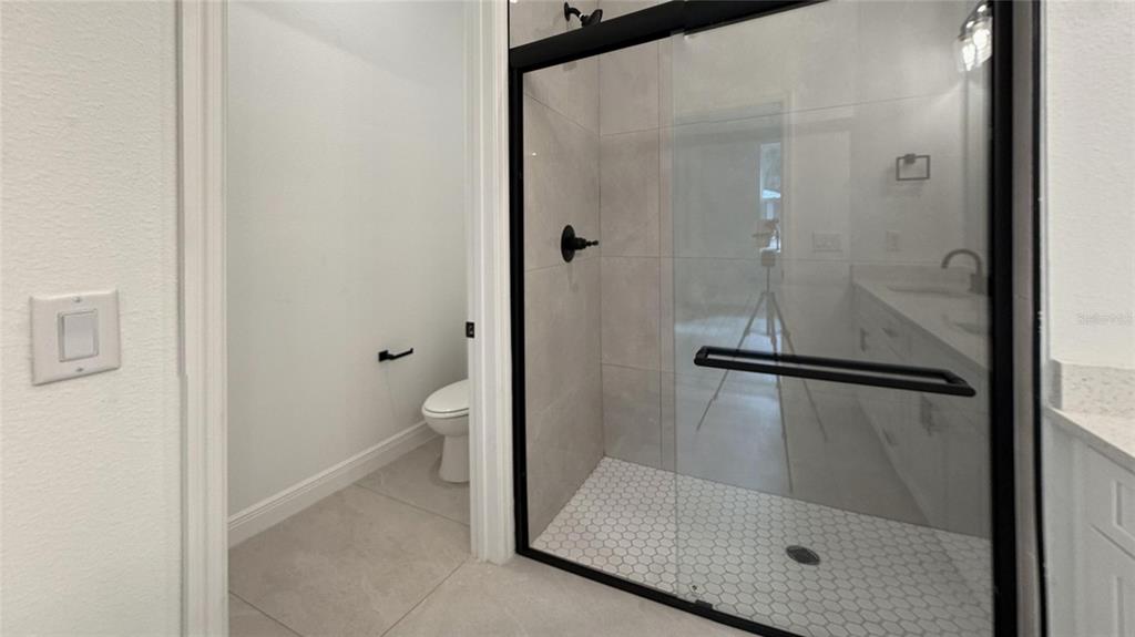 2018 West Magenta Drive Citrus Springs, FL 34434 - Photo 7 of 19 a bathroom with a glass shower door