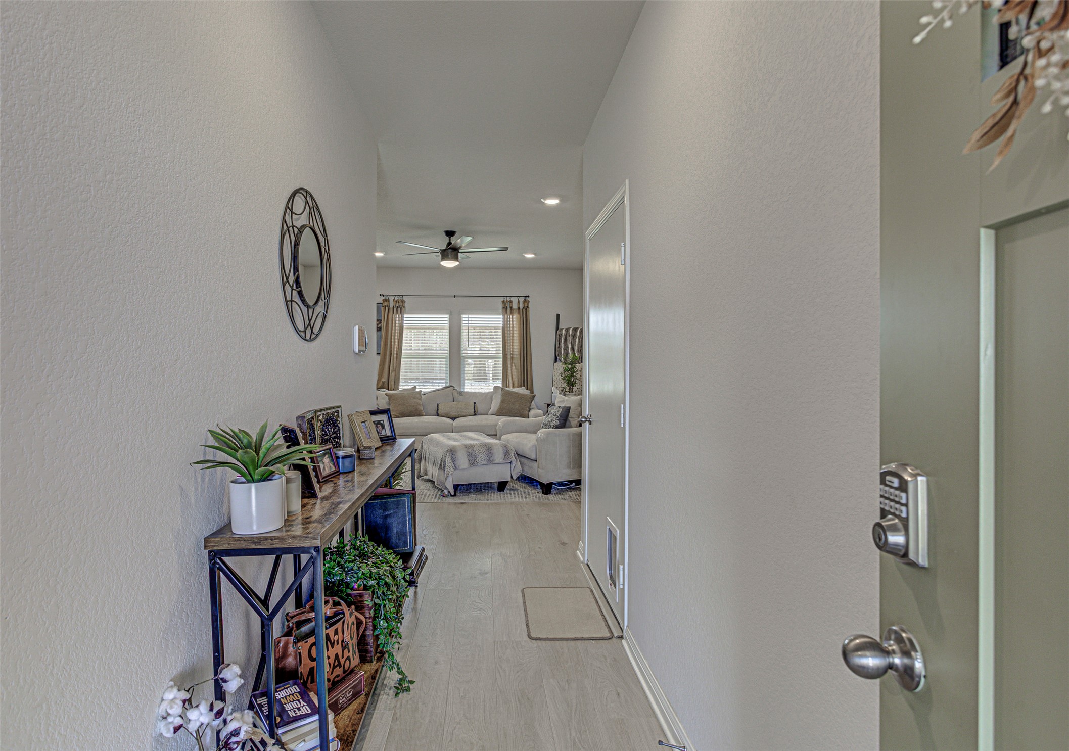 309 Lone Cedar Road Marble Falls, TX 78654 - Photo 5 of 35 Corridor featuring a textured wall, light wood-style floors, and recessed lighting