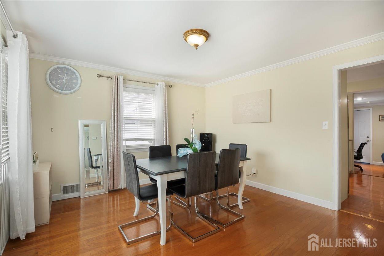 580 Schuyler Way Union, NJ 07083 - Photo 11 of 30 a view of a dining room with furniture and wooden floor