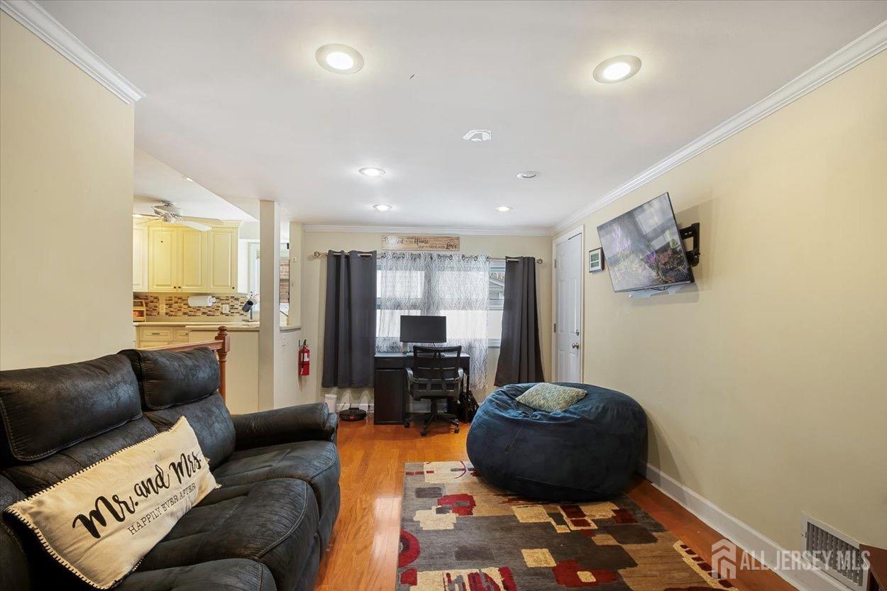 580 Schuyler Way Union, NJ 07083 - Photo 16 of 30 a living room with furniture and a flat screen tv