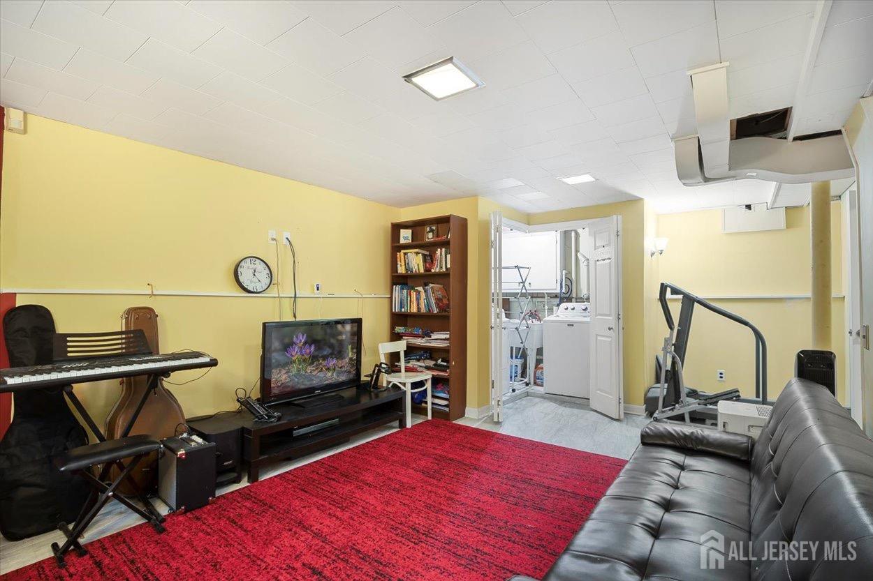 580 Schuyler Way Union, NJ 07083 - Photo 20 of 30 a bedroom with furniture and a flat screen tv