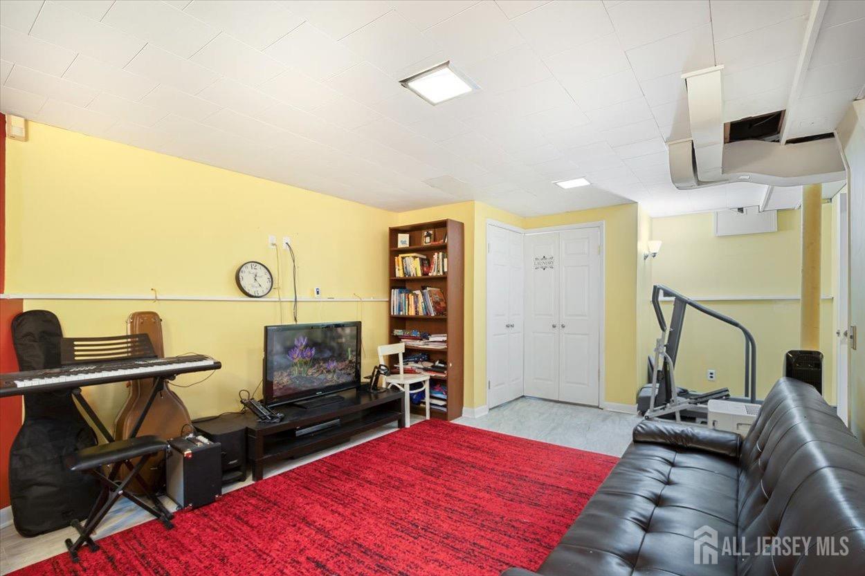 580 Schuyler Way Union, NJ 07083 - Photo 21 of 30 a bedroom with furniture and a flat screen tv