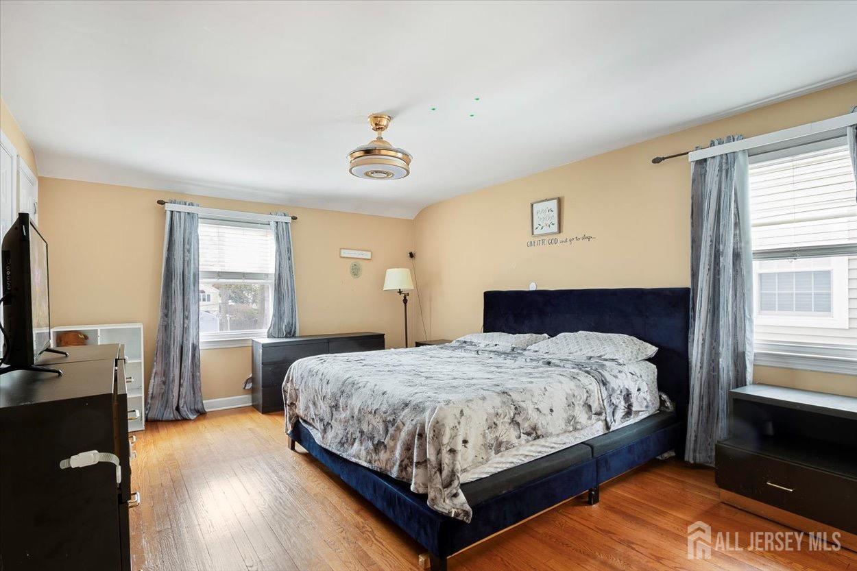 580 Schuyler Way Union, NJ 07083 - Photo 26 of 30 a bedroom with a bed and wooden floor