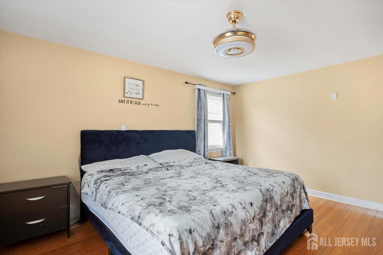 580 Schuyler Way Union, NJ 07083 - Photo 27 of 30 a bedroom with a bed and a window