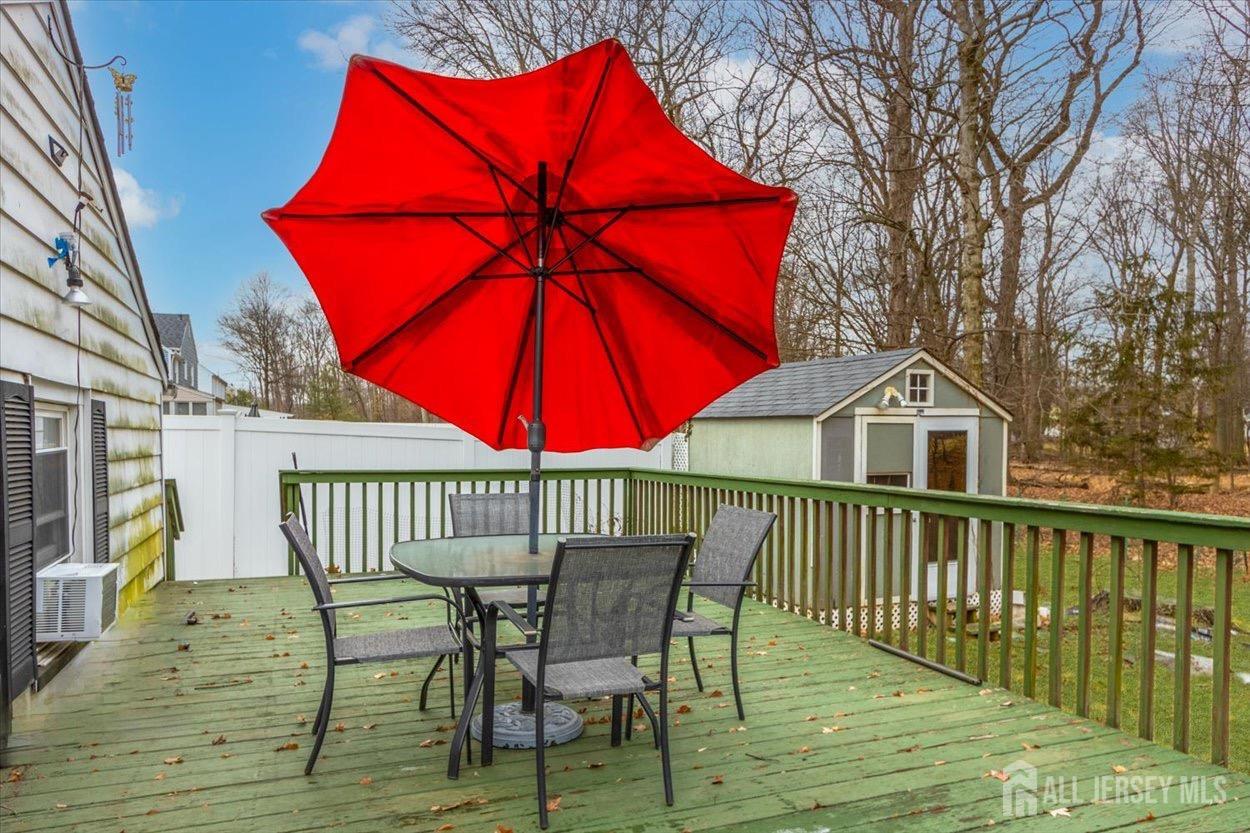 580 Schuyler Way Union, NJ 07083 - Photo 5 of 30 a view of a wooden deck with furniture