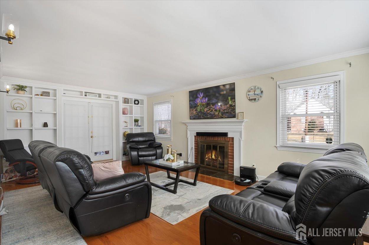 580 Schuyler Way Union, NJ 07083 - Photo 8 of 30 a living room with furniture and a fireplace