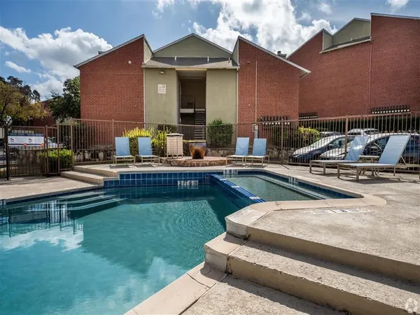 a swimming pool with outdoor seating and yard