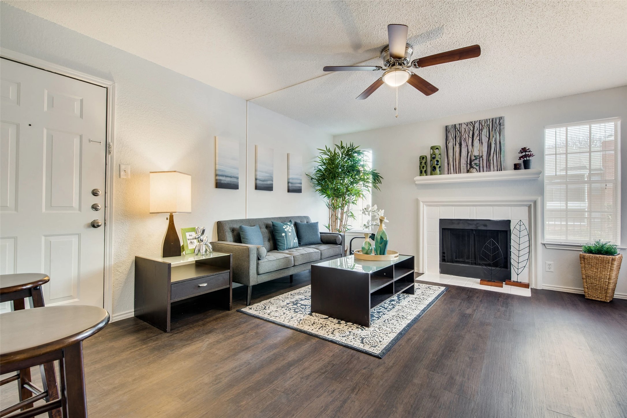 7610 Cameron Road, Unit 2075 Austin, TX 78752 - Photo 7 of 42 a living room with furniture and a fireplace