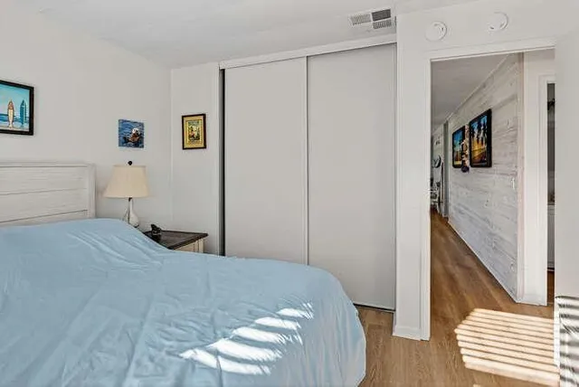 a bedroom with a bed and a table in it