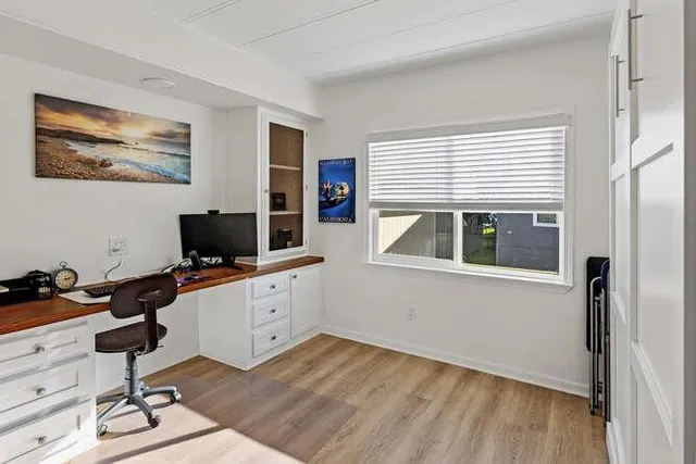 a workspace with furniture and window