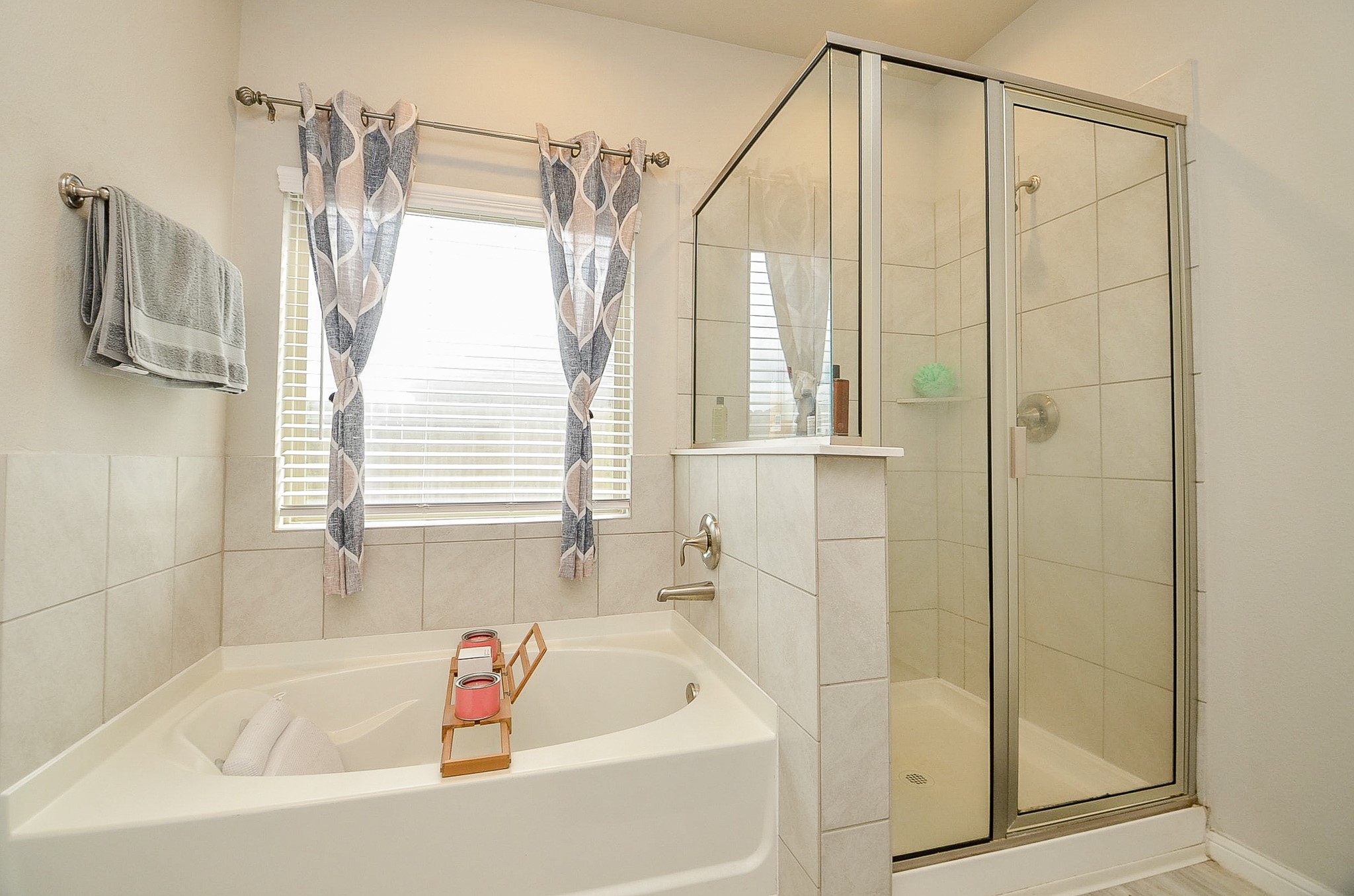 10519 Scrub Oak Drive Rosharon, TX 77583 - Photo 23 of 32 a bathroom with a bathtub a shower and a window
