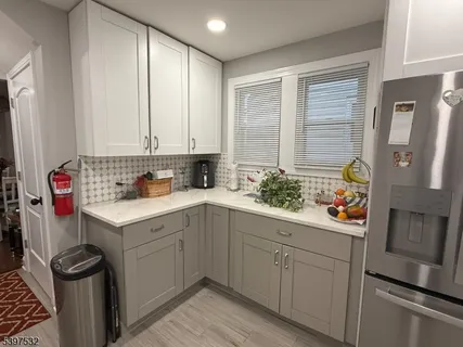 a utility room with cabinets washer and dryer